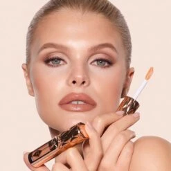 BIG LIP PLUMPGASM NUDEGASM DIAMONDS -Charlotte Tillbury Store 250001 SUPERNUDES25 img vm CM Feb 03 MegHero FinalLookholdingPlumpgasmNudegasm 1000x1000