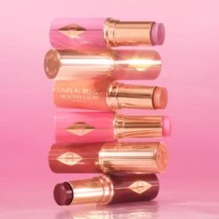 UNREAL BLUSH HEALTHY GLOW STICK ROSY GLOW -Charlotte Tillbury Store 250005 unrealsummer25 img sl SF 0325 hero tower 1000 x 1000 2